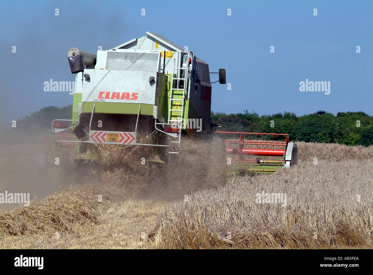 Barley Field and Combine Harvester in Hampshire England UK Stock Photo ...