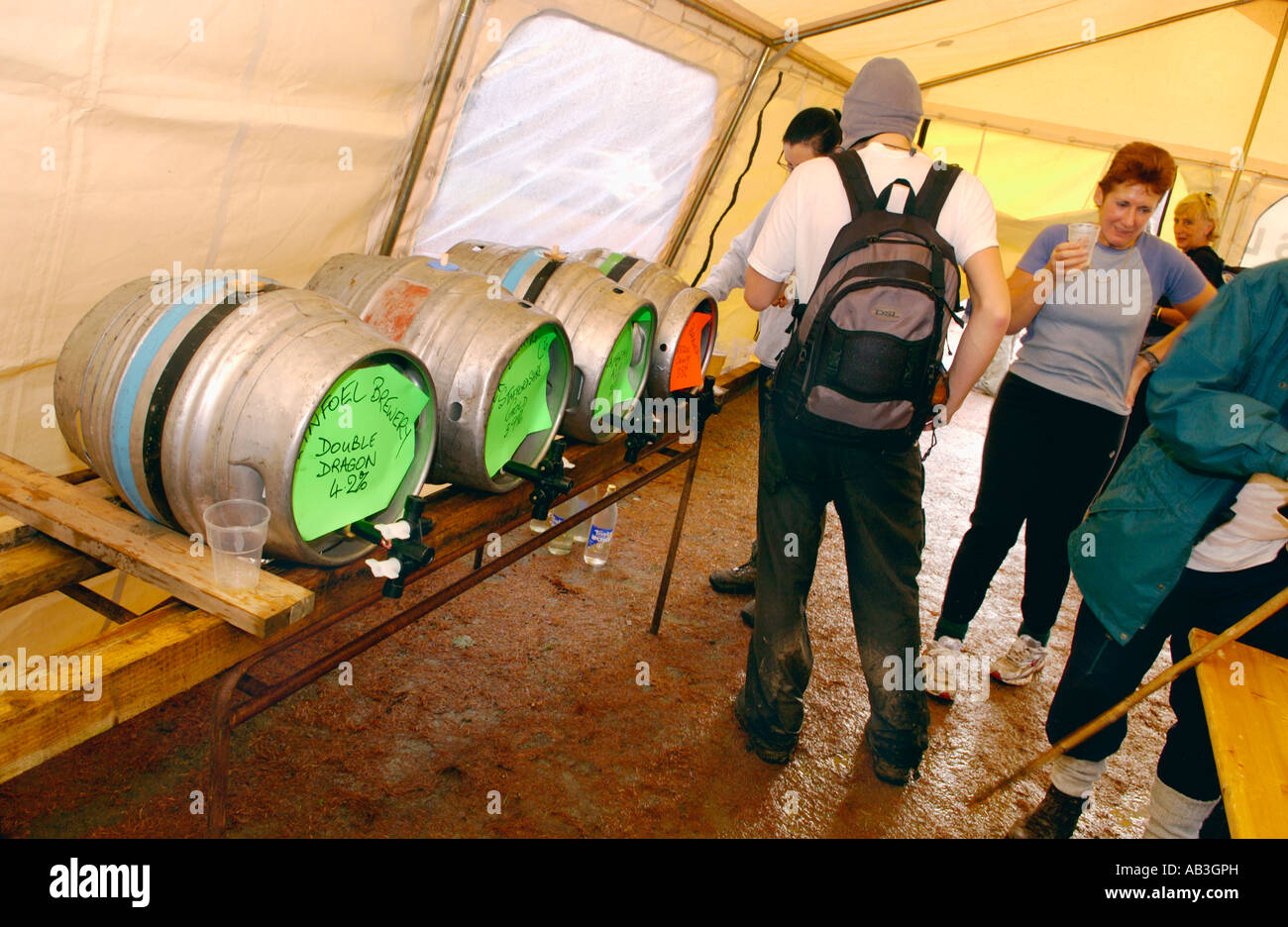 Walkers taking part in the Real Ale Ramble Walking Festival stop for a ...