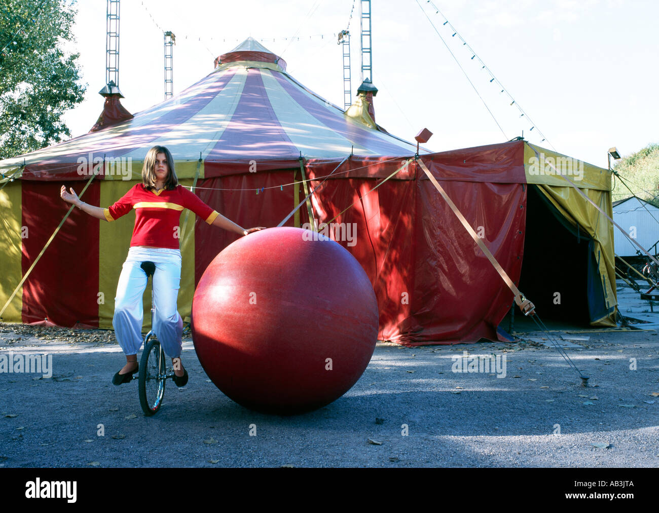 young circus kid on one wheel Stock Photo