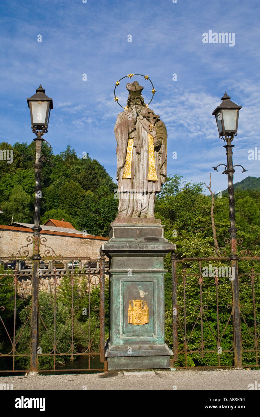 A statue of St. Janez Nepomuk on the Cappuchin Bridge from14th century is the oldest preserved bridge in Slovenia. Stock Photo