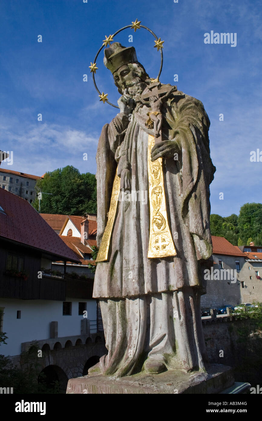 A statue of St. Janez Nepomuk on the Cappuchin Bridge from14th century is the oldest preserved bridge in Slovenia. Stock Photo