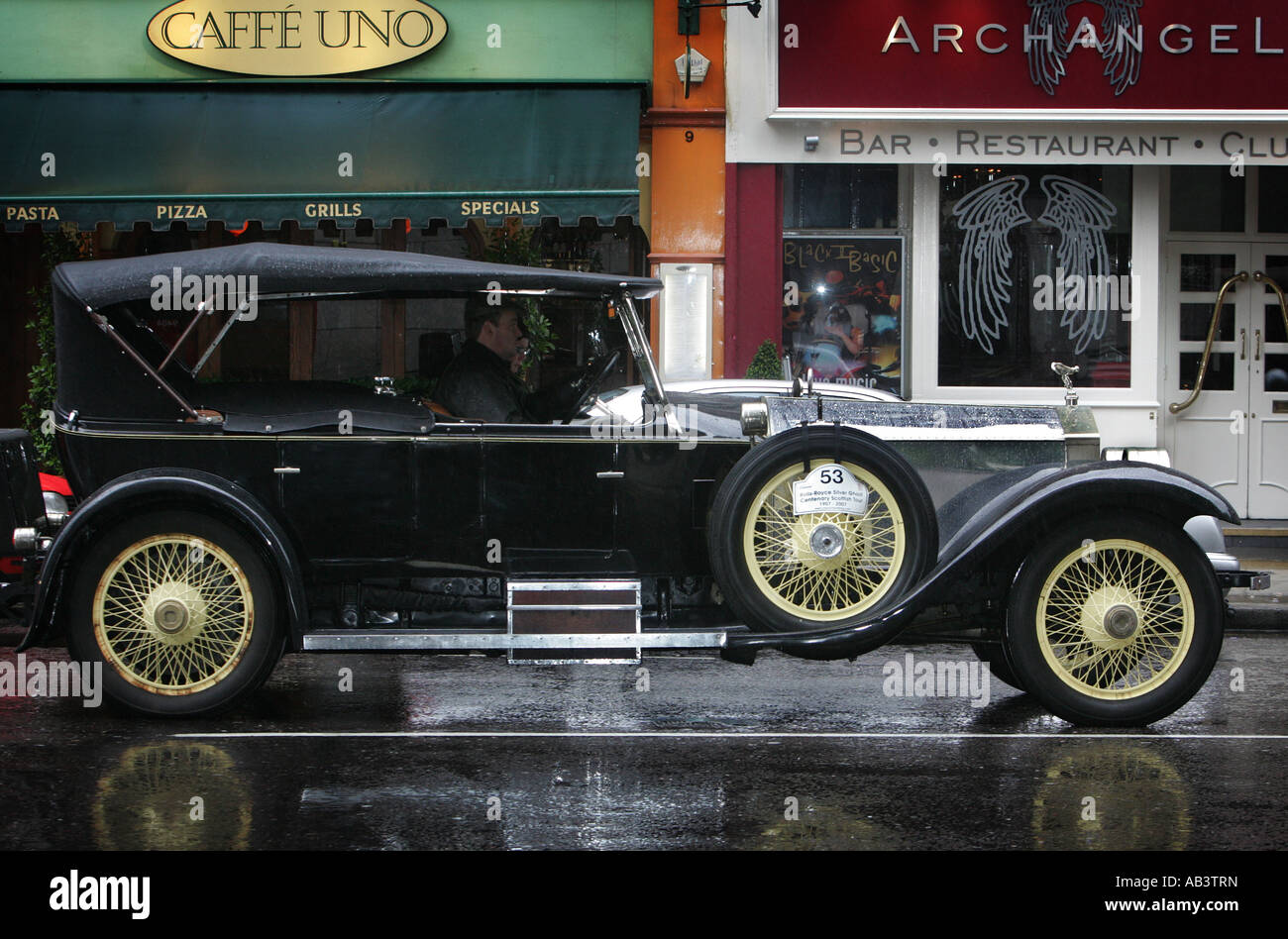 Vintage car in front of a restaurant, Kensington, London, England Stock Photo