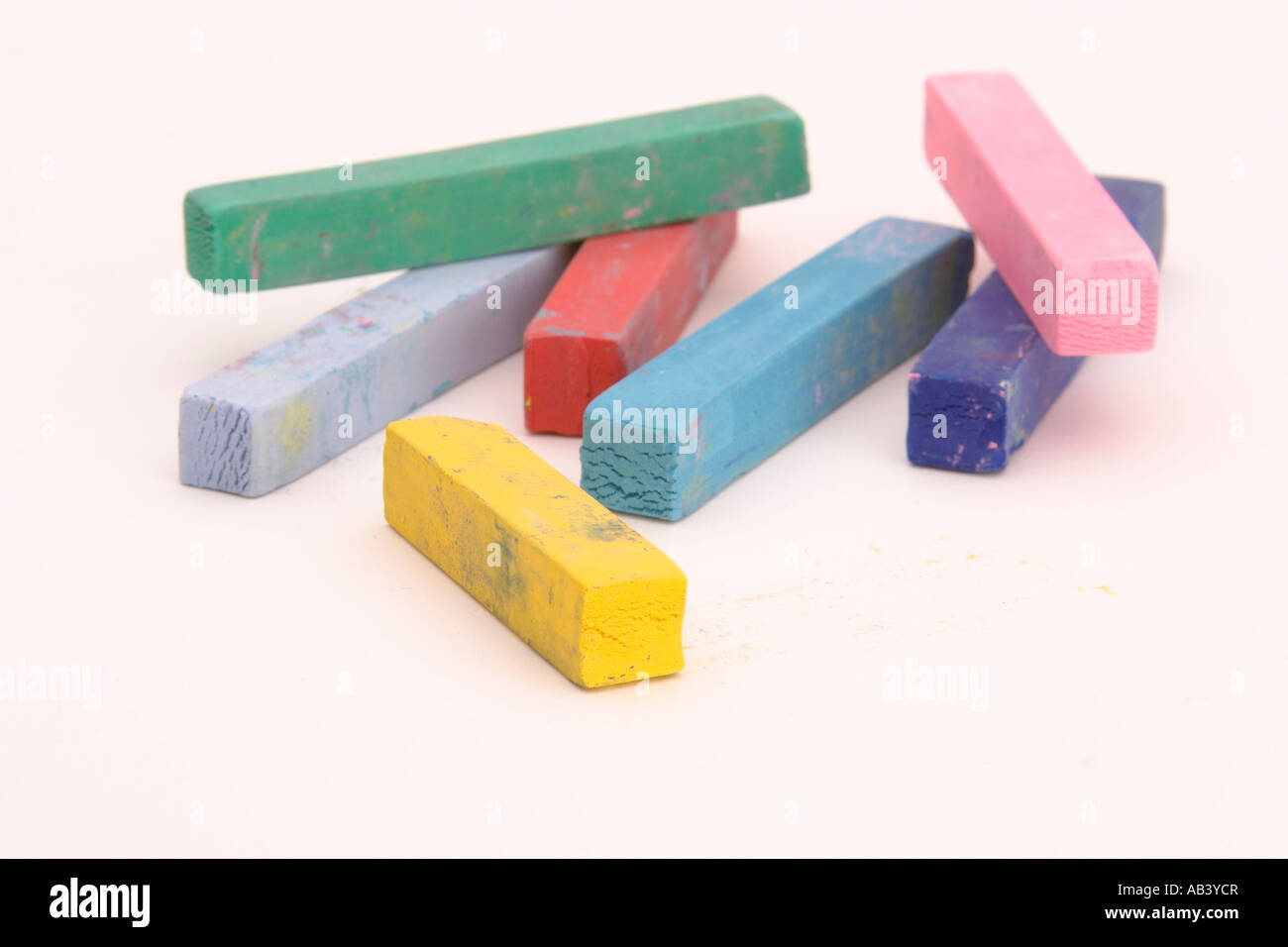 Multi Coloured Chalk sticks on a plain background Stock Photo - Alamy