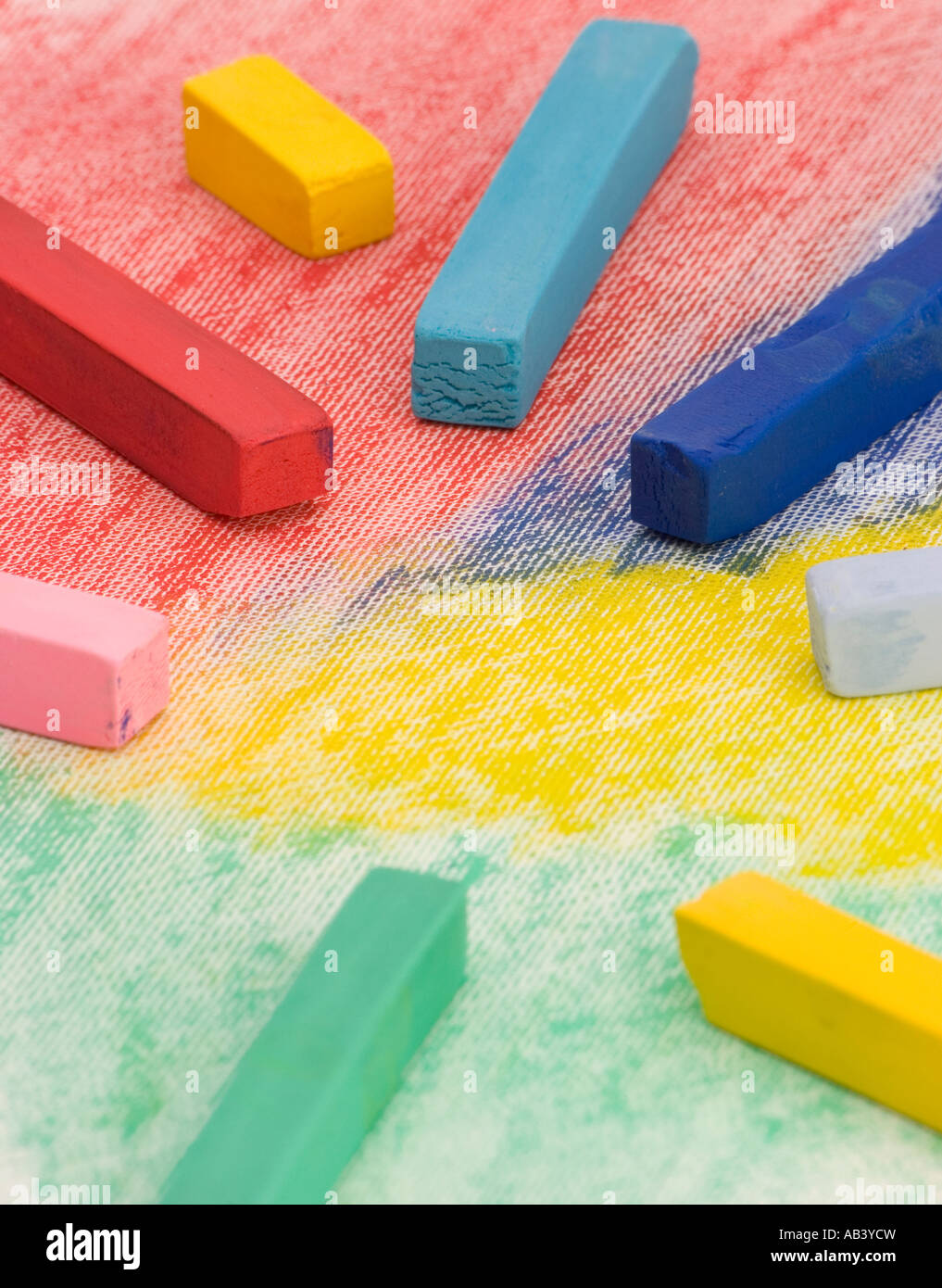 Multi Coloured Chalk sticks on a plain background Stock Photo Alamy