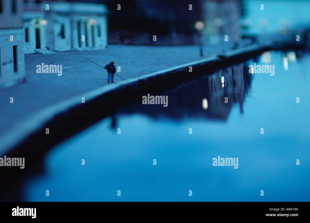 Venice Man fishing in a canal in Venice Italy "Fine Art Photography" Stock Photo
