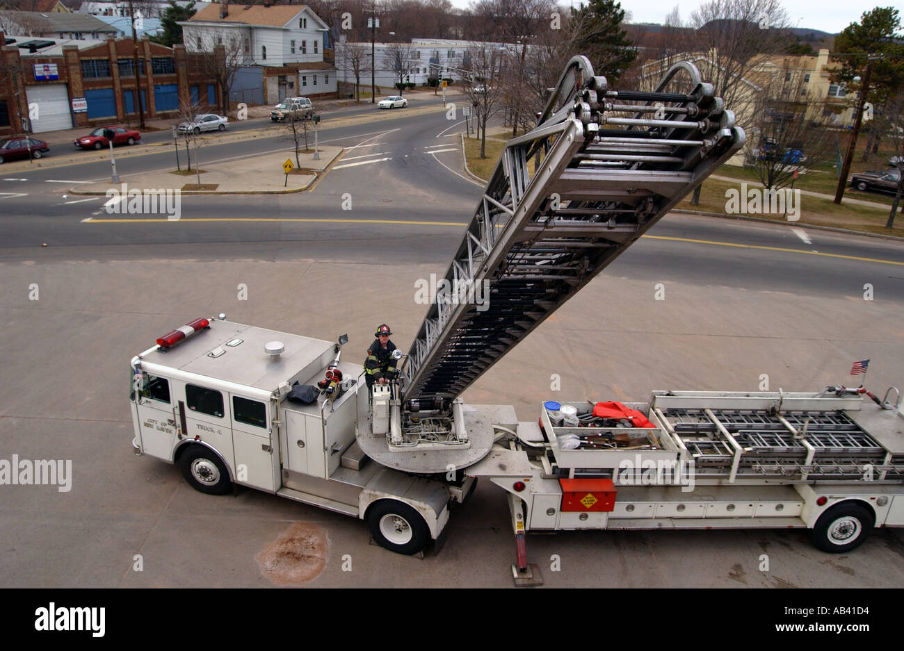 Fire ladder truck extending up toward camera Stock Photo Alamy