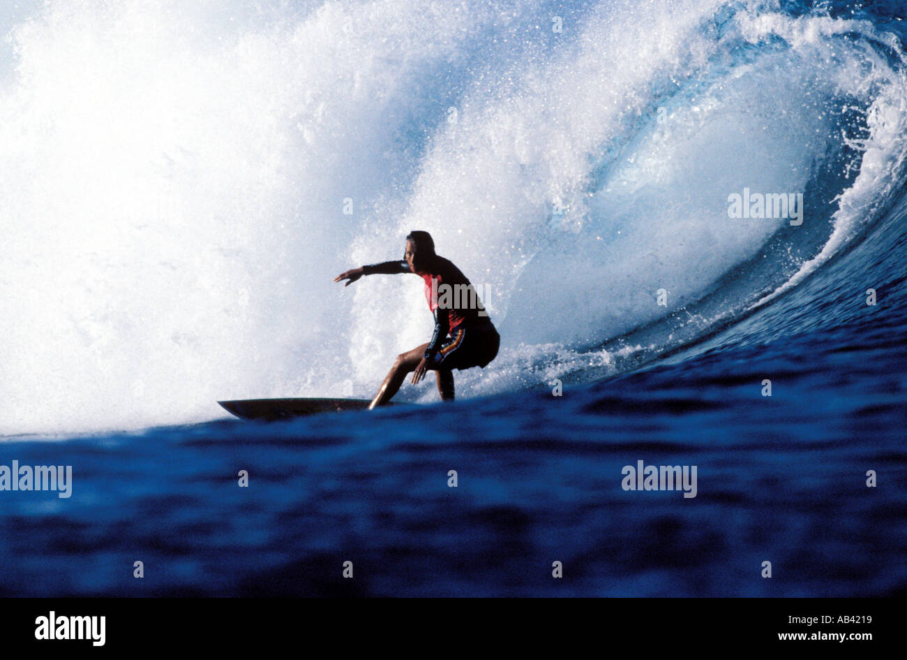 Surfing Tahiti Stock Photo