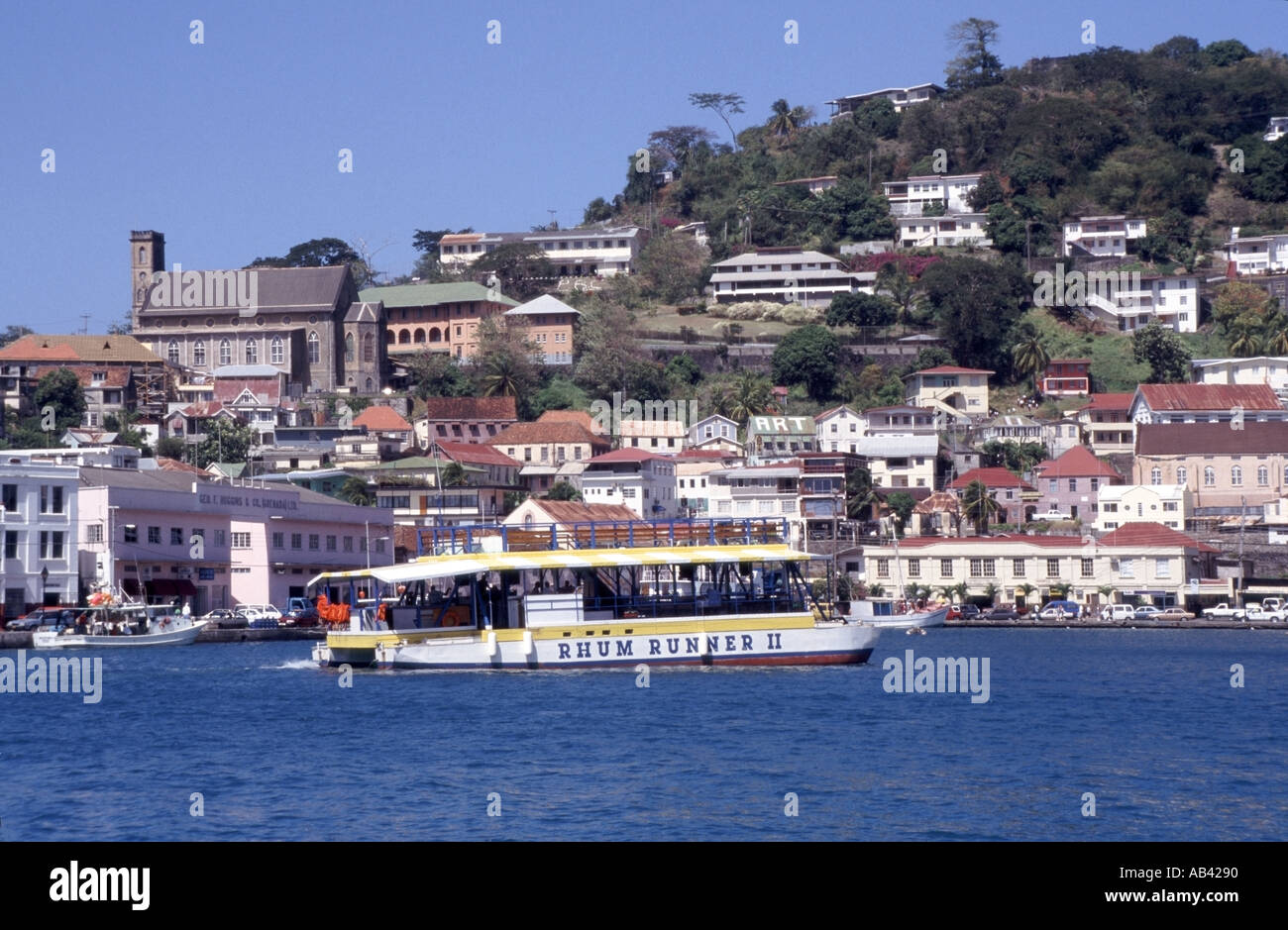 St Georges harbour in the south eastern Caribbean Sea Rhum Runner boat with passengers on relaxing leisure trip Stock Photo