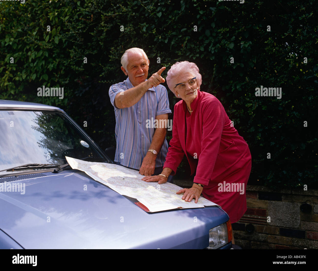 Senior couple by car Stock Photo