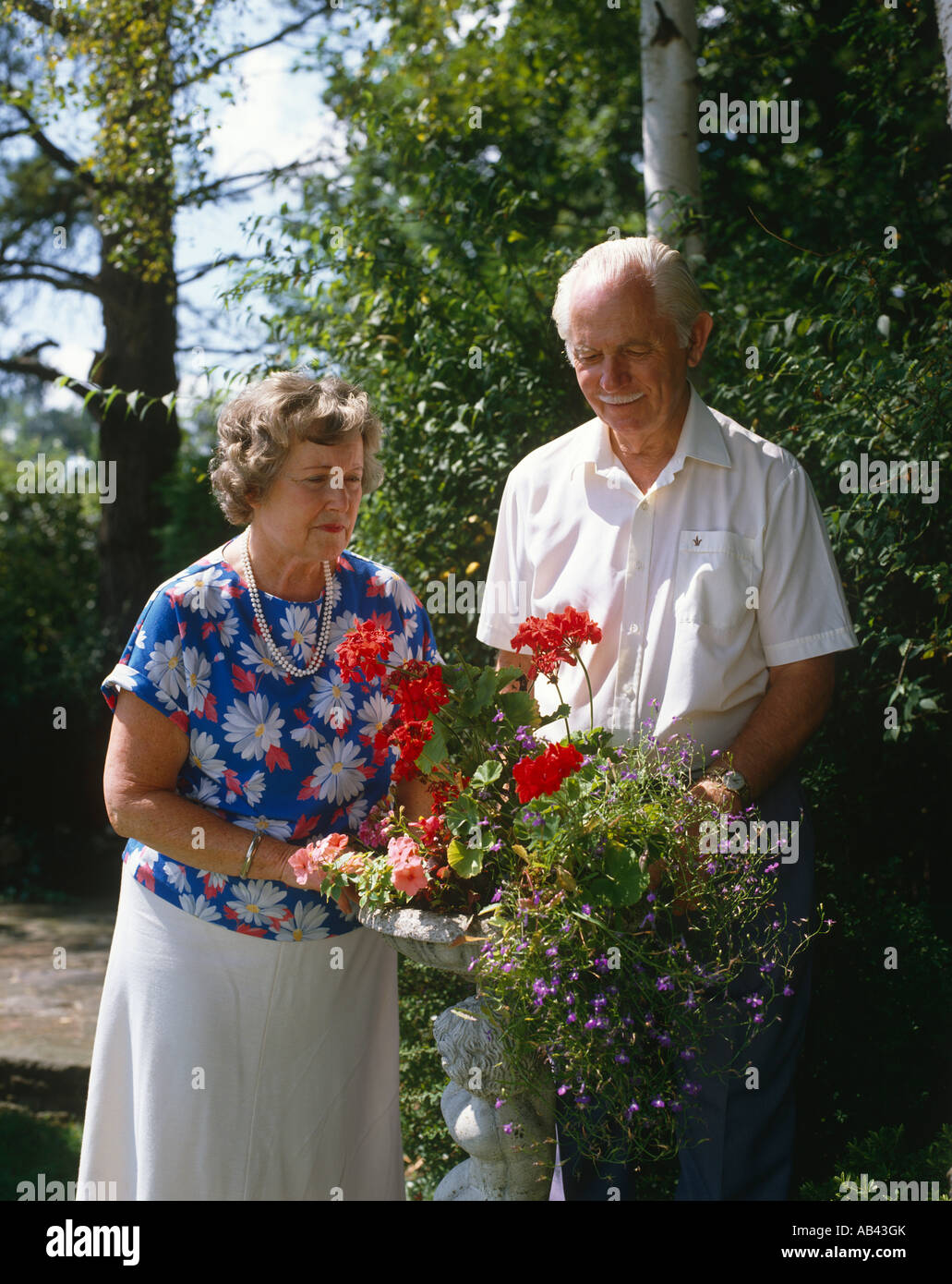 Senior couple outside gardening Stock Photo