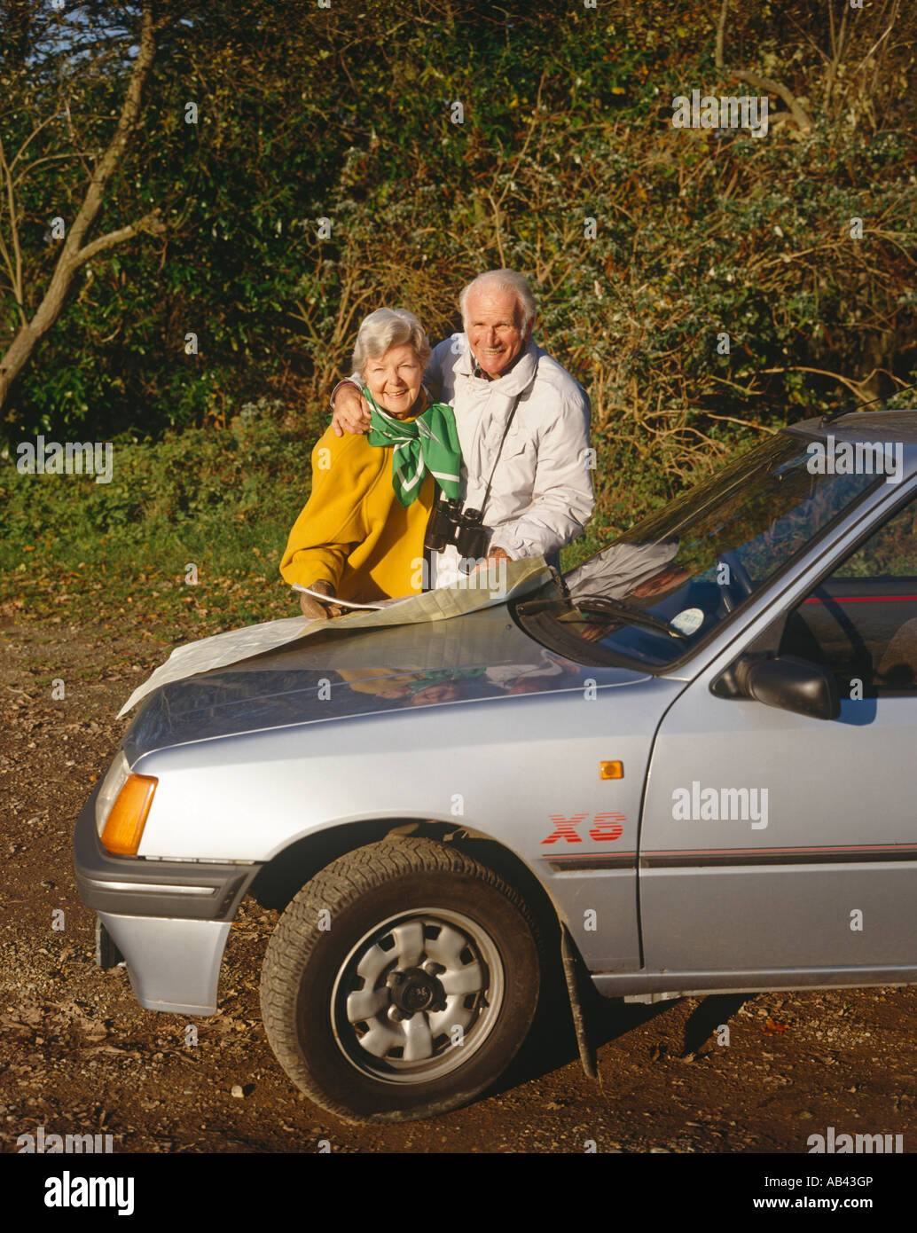 Senior couple by road Stock Photo