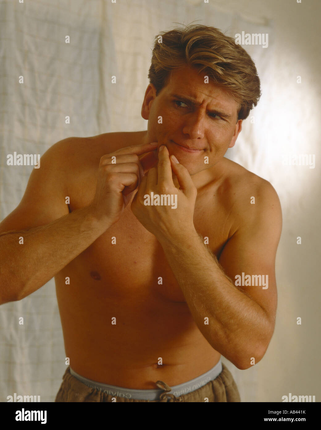 Male squeezing spot Stock Photo Alamy