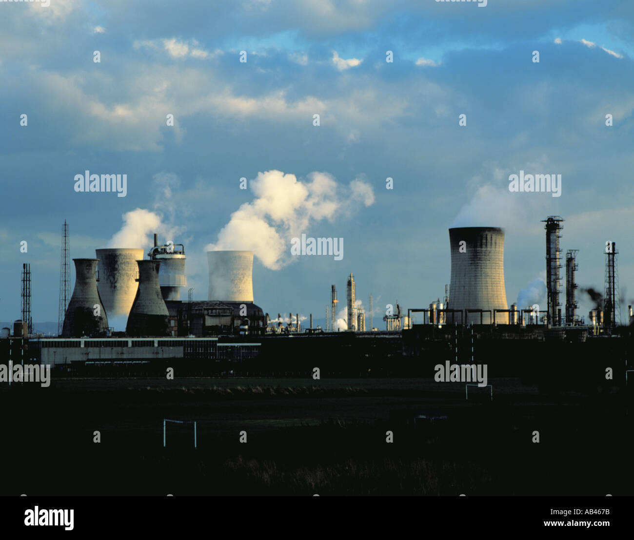 Chemical complex and cooling towers seen over playing fields, Billingham, Teesside, Cleveland, England, UK. in the 1980s Stock Photo