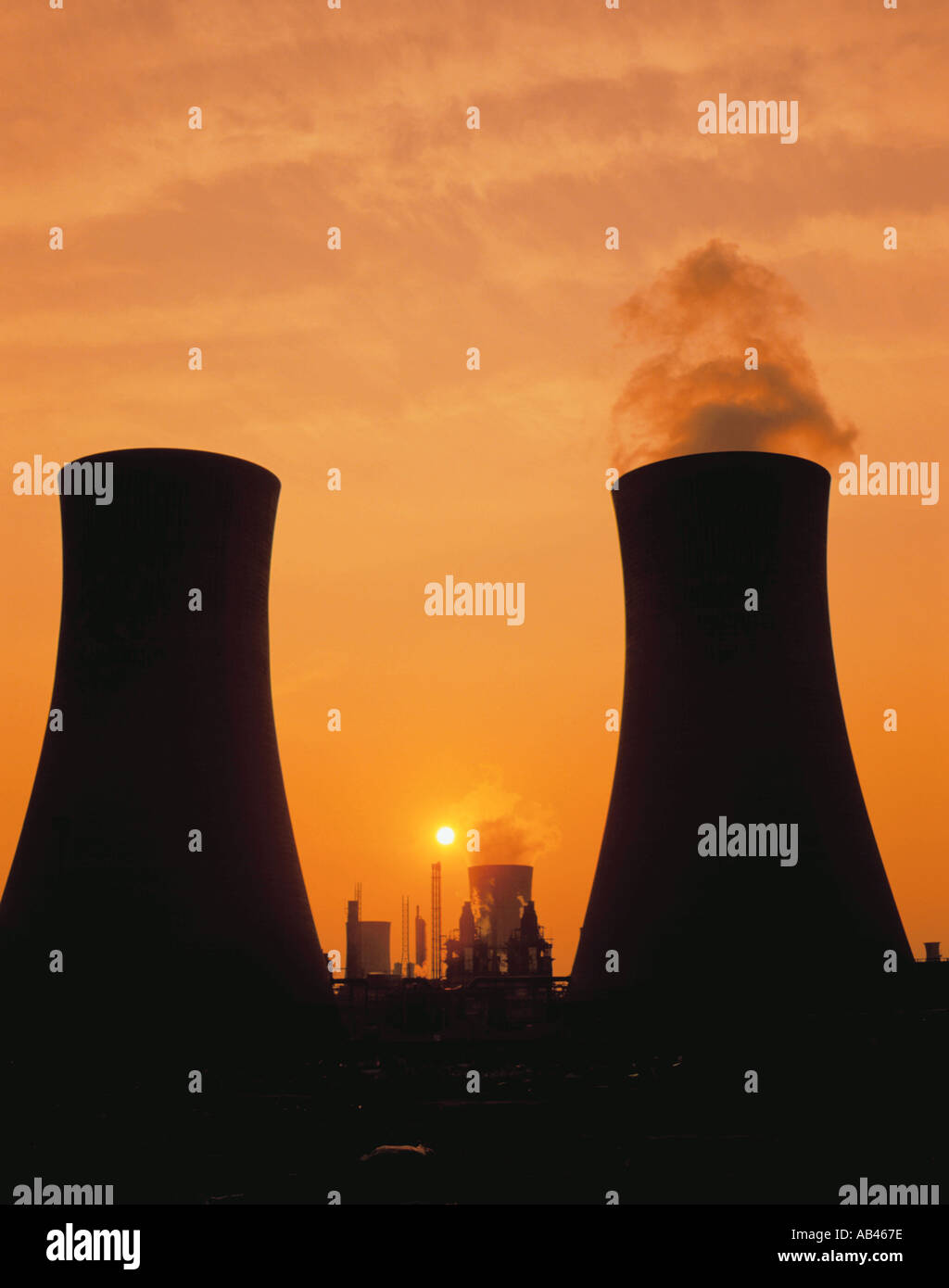 Sunset seen between cooling towers, Billingham, Teesside, Cleveland, England, UK. Stock Photo