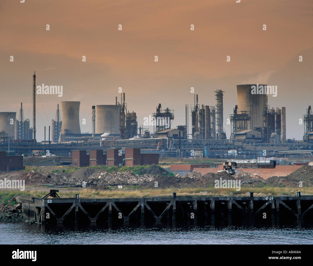 Chemical complex and cooling towers seen over River Tees and derelict land, Billingham, Teesside, Cleveland, England, UK. in the 1980s Stock Photo
