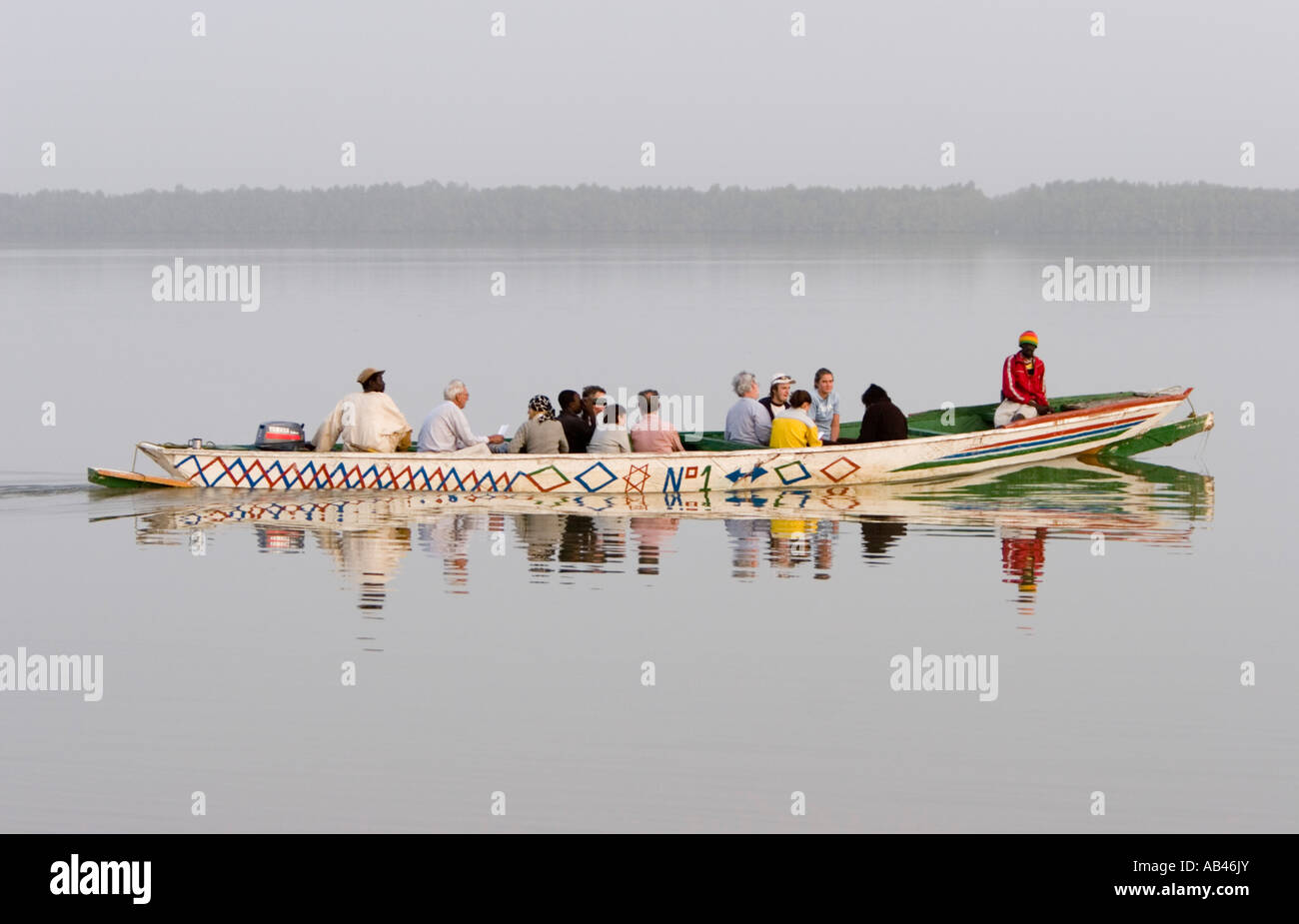 Bird watchers start river wildlife trip from Tendaba Camp jetty The Gambia Stock Photo