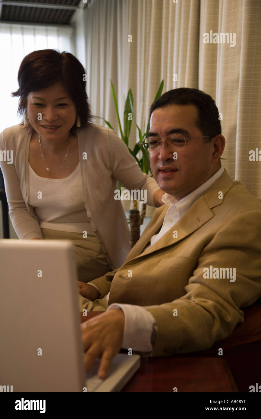 Mature couple using computer Stock Photo - Alamy
