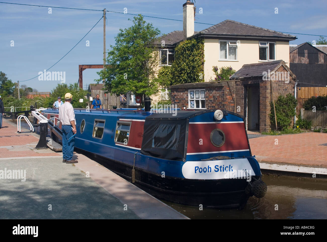 Narrowboat leaving Grindley Brook staircase locks on the Llangollen Canal near Whitchurch in Shropshire Stock Photo