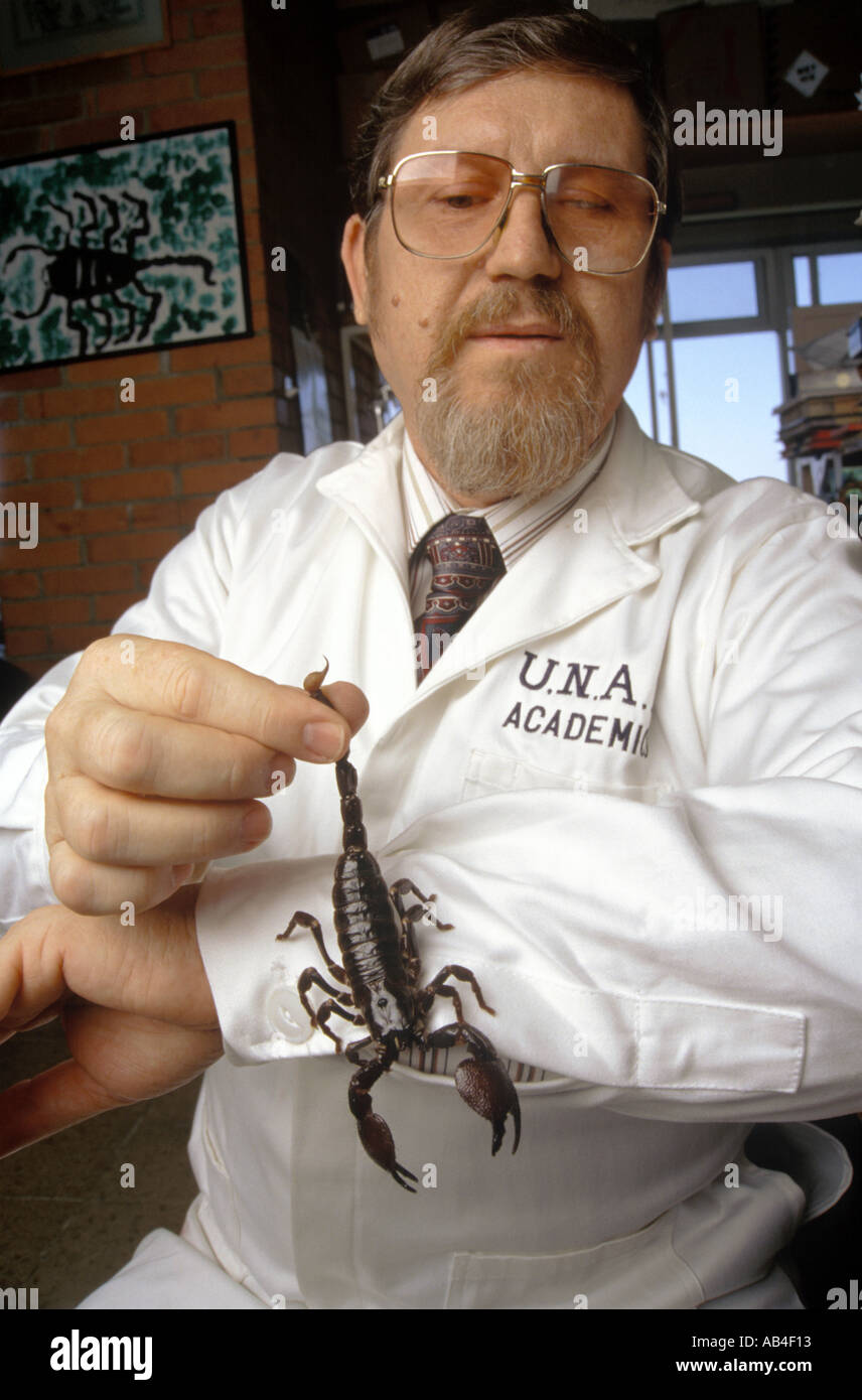 World renowned biologist Dr Luis Possani holds a scorpion that he uses in his work developing an anti serum to the insect sting Stock Photo