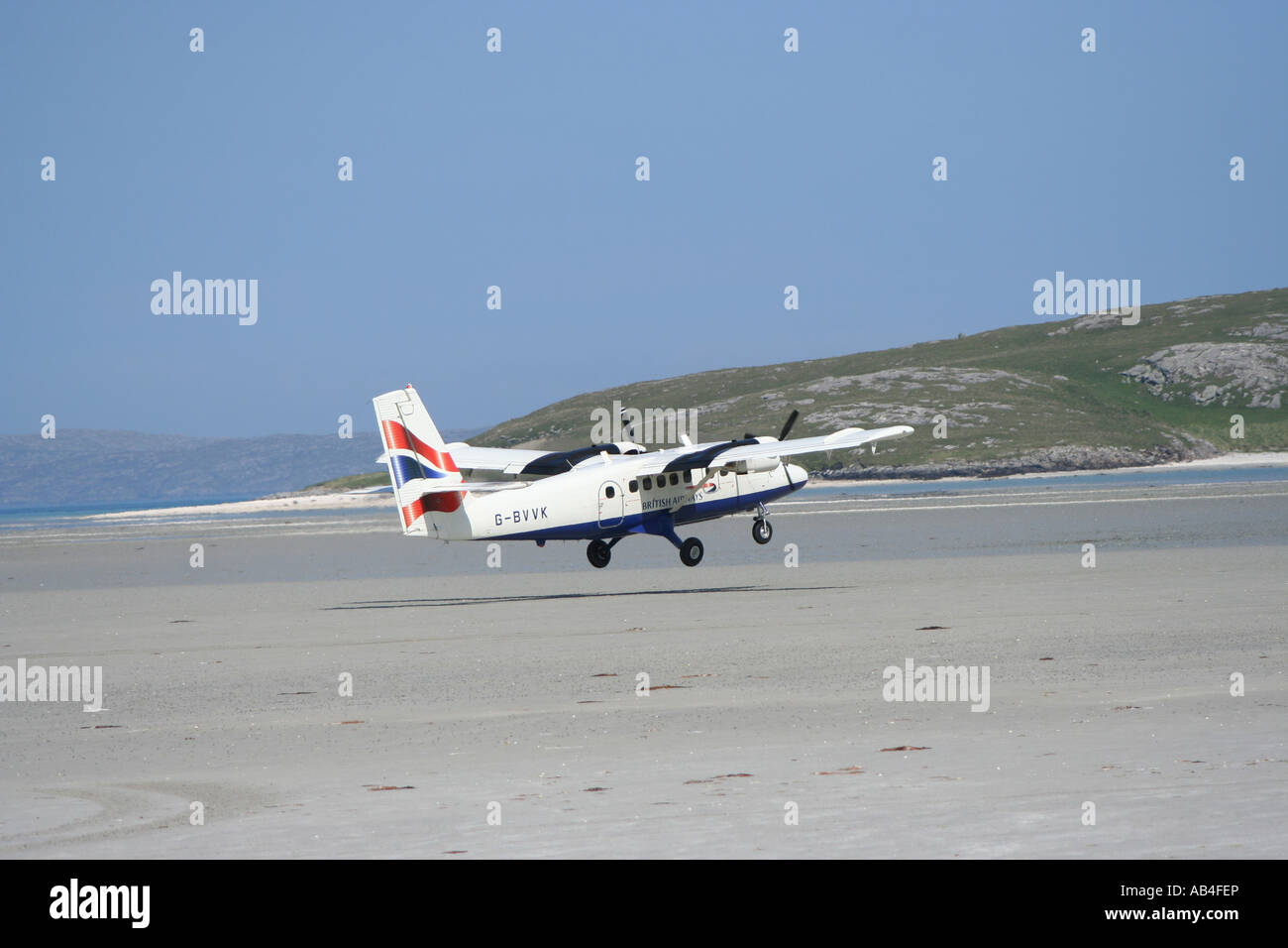Propeller plane taking off from beach runway Barra airport Isle of Barra Outer Hebrides Scotland