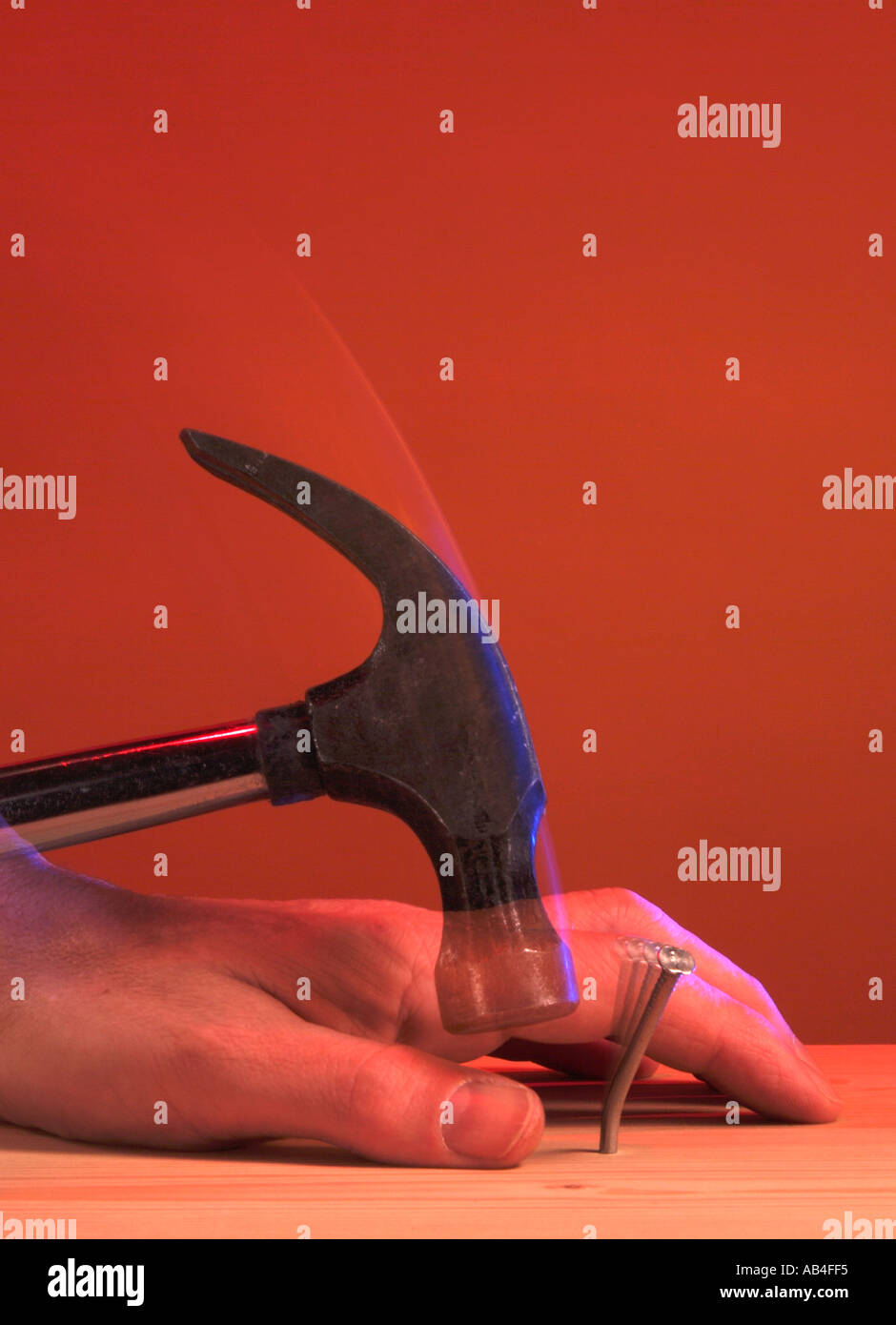 Hammer hitting thumb hires stock photography and images Alamy