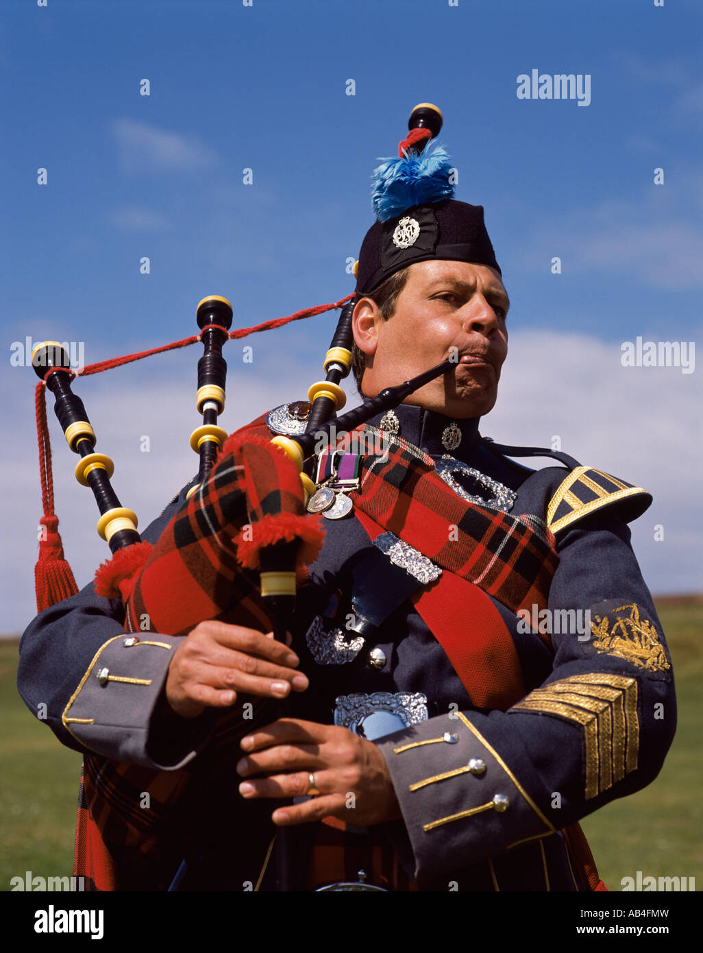 Piper Blowing Bagpipes Stock Photo Alamy