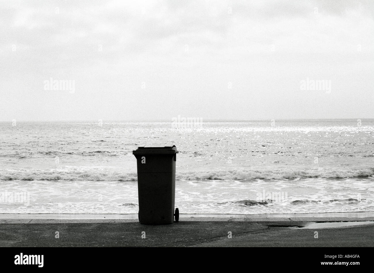 A rubbish bin silhouetted against the Bournemouth coastline Stock Photo