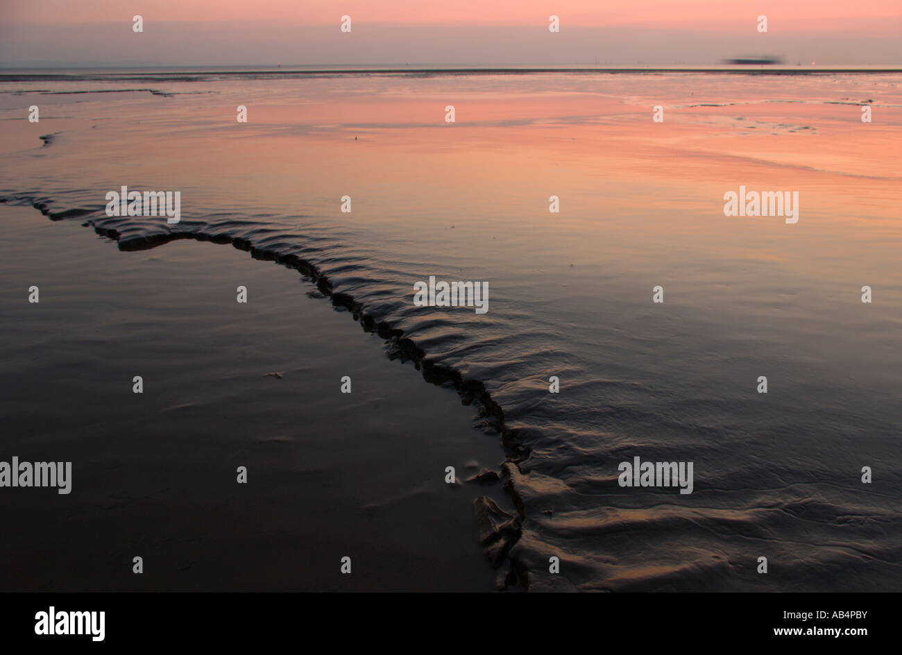 Twilight mud reflection , Crosby Beach Stock Photo