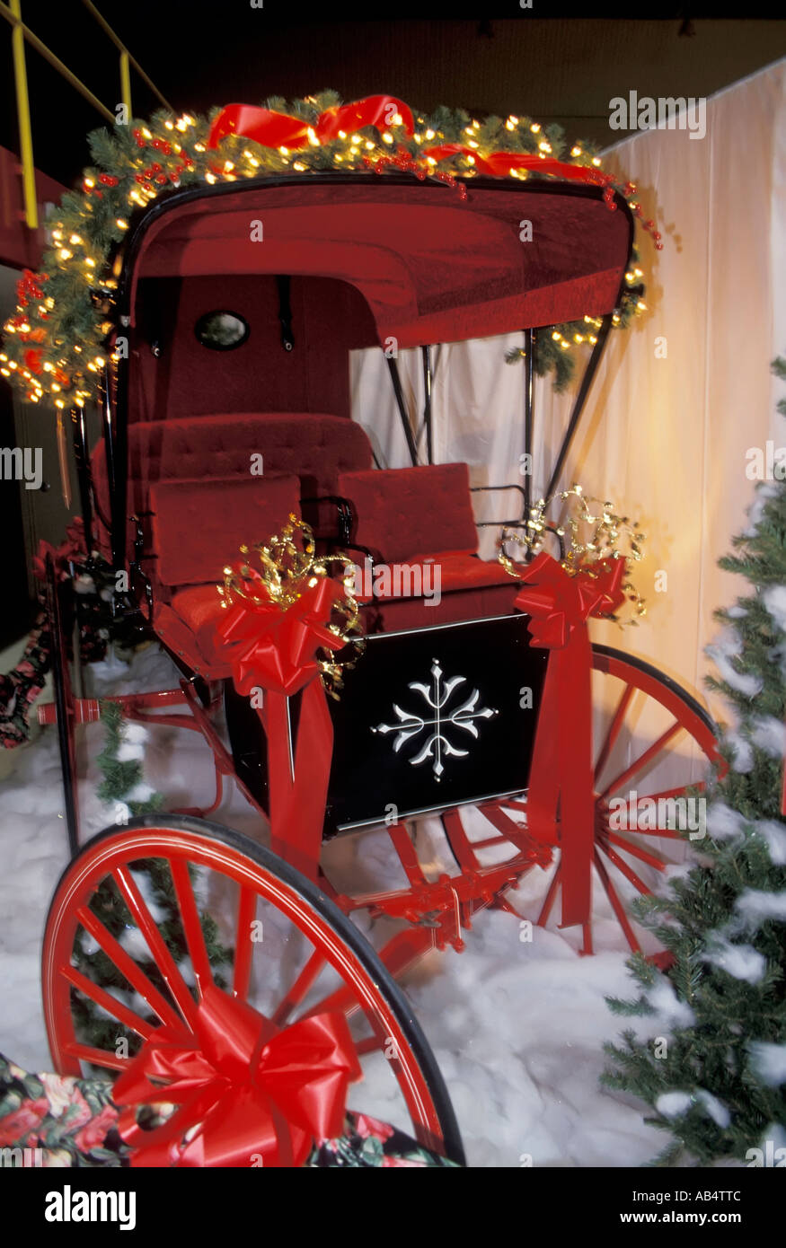 Still life of a Christmas scene with a red buggy Stock Photo