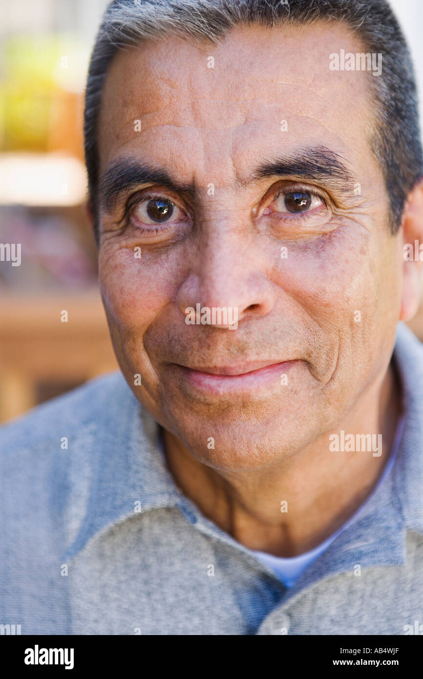 Mature hispanic man indoors in hi-res stock photography and images - Alamy