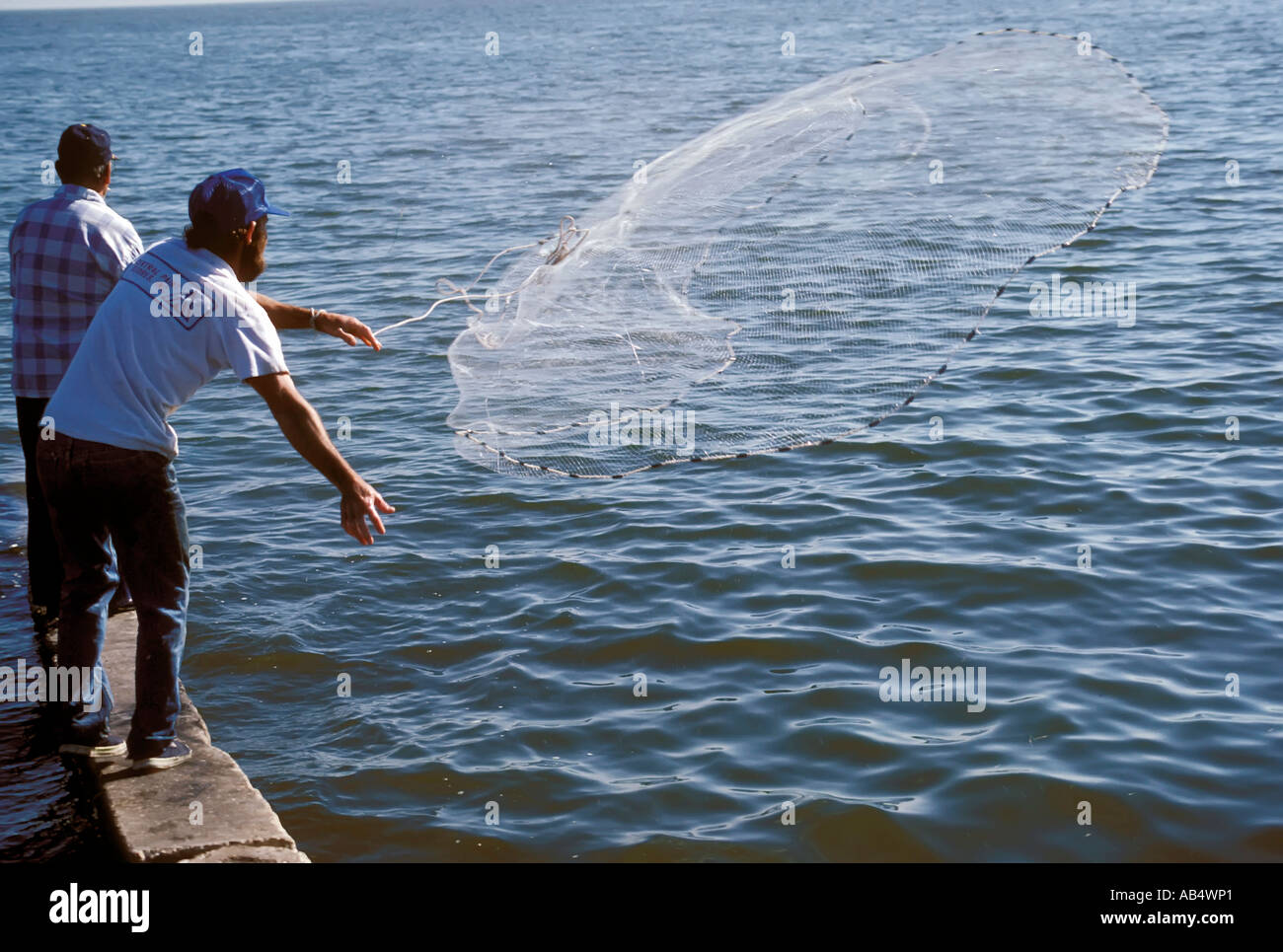 Recreational net fishing from the St Petersburg Florida Pier Stock Photo