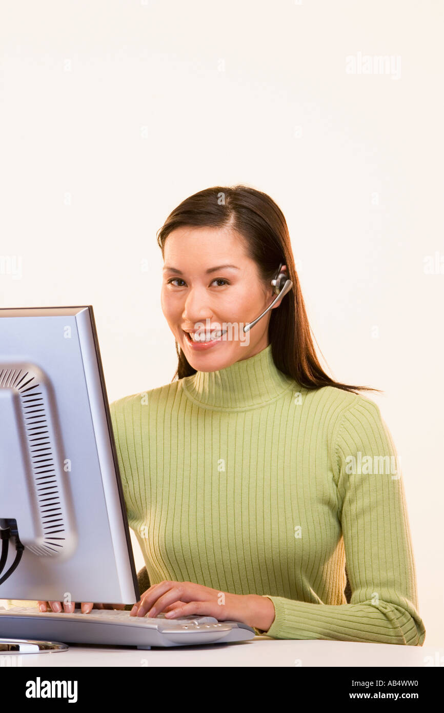 Portrait of businesswoman at computer Stock Photo