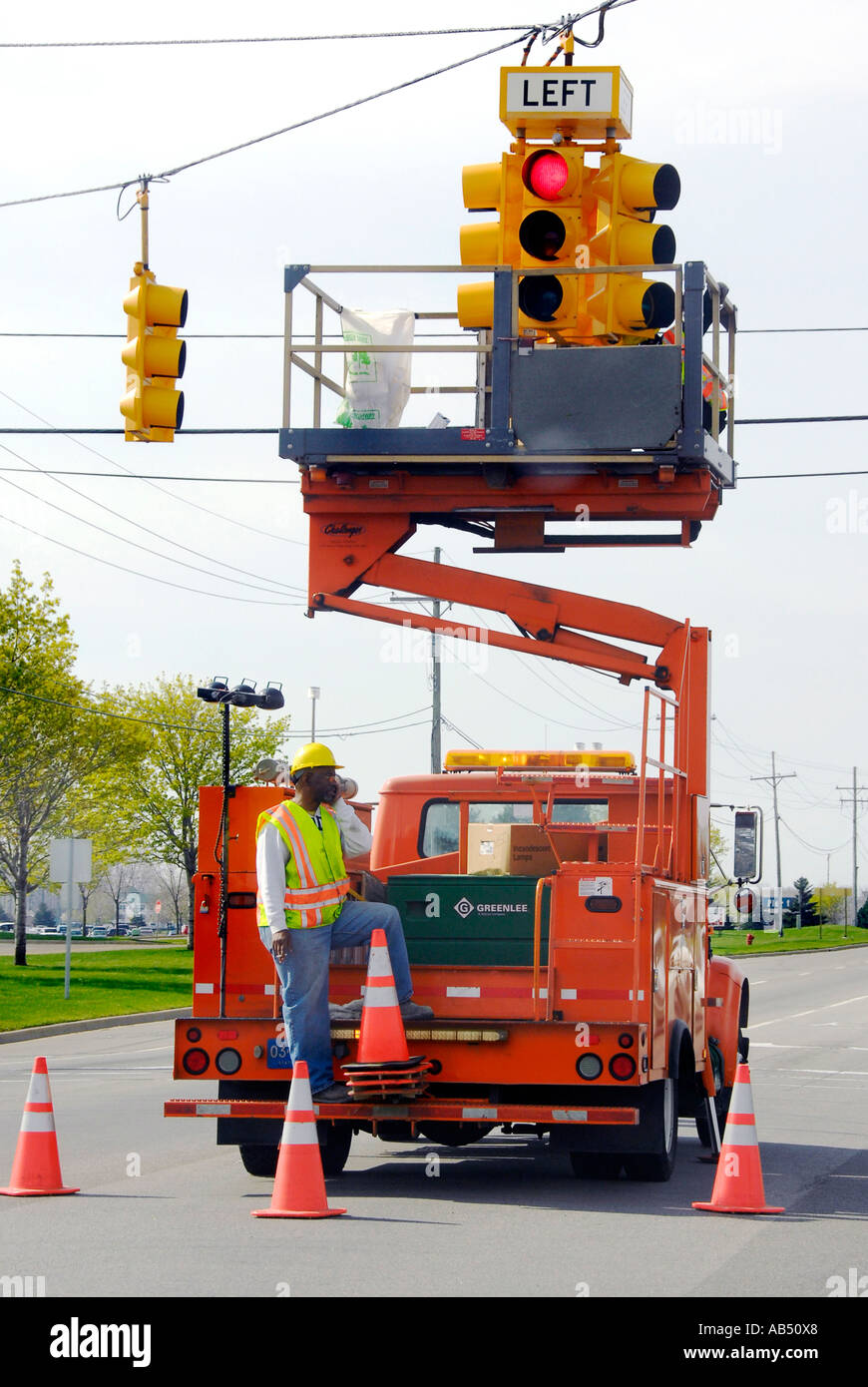 Maintenance crew works to restore fix and refurbish a street traffic