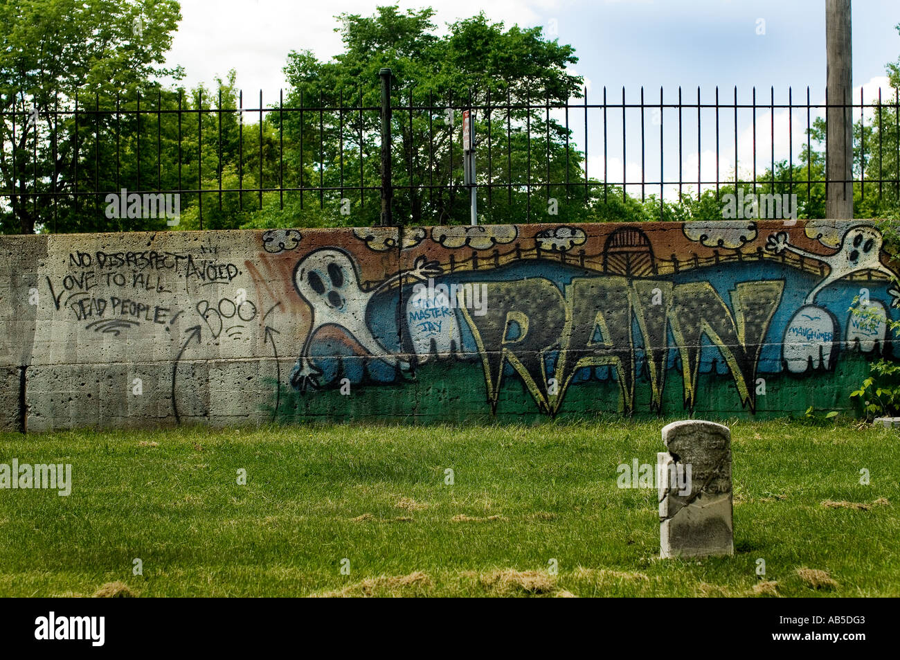 graffiti-on-a-wall-in-a-cemetery-AB5DG3.jpg