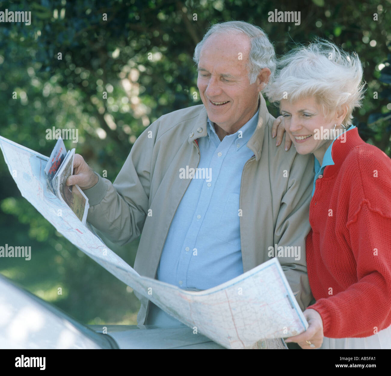 mature couple with road map planning trip Stock Photo