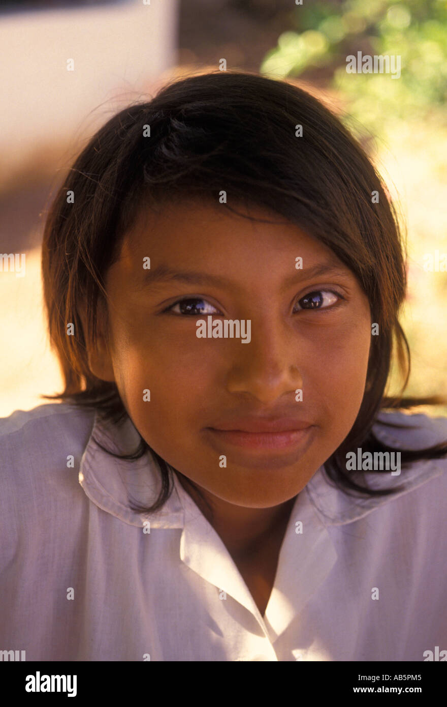 1, one, Maya girl, Mayan girl, young girl, child, eye contact, front view, smiling, town of Tahmek, Tahmek, Yucatan State, Yucatan Peninsula, Mexico Stock Photo