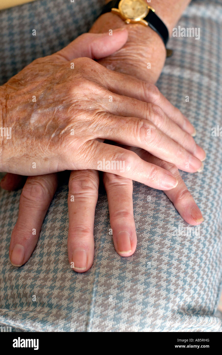Elderly hands resting on lap hi-res stock photography and images - Alamy
