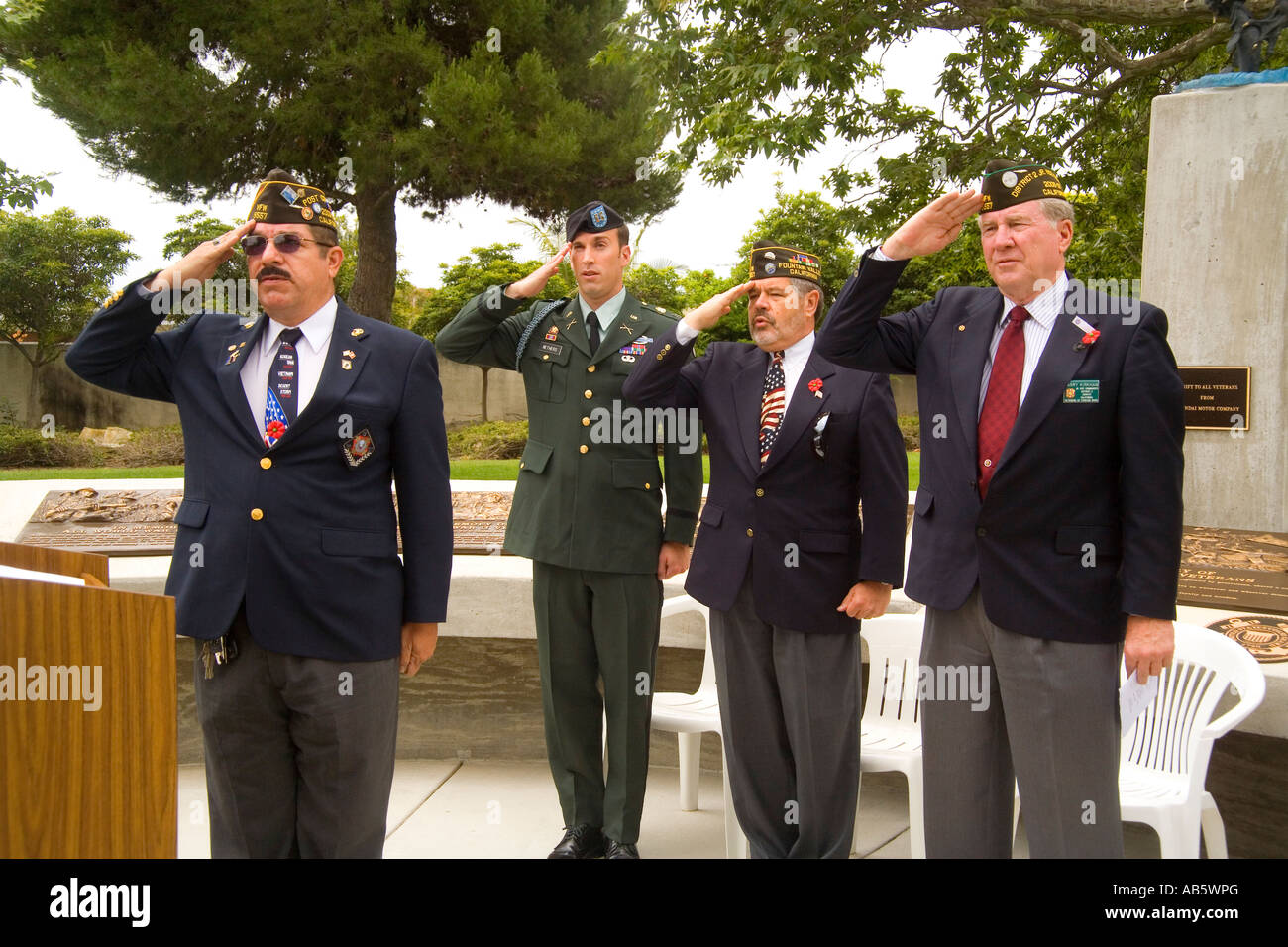 City officials salute the flag during Memorial Day ceremonies Stock ...
