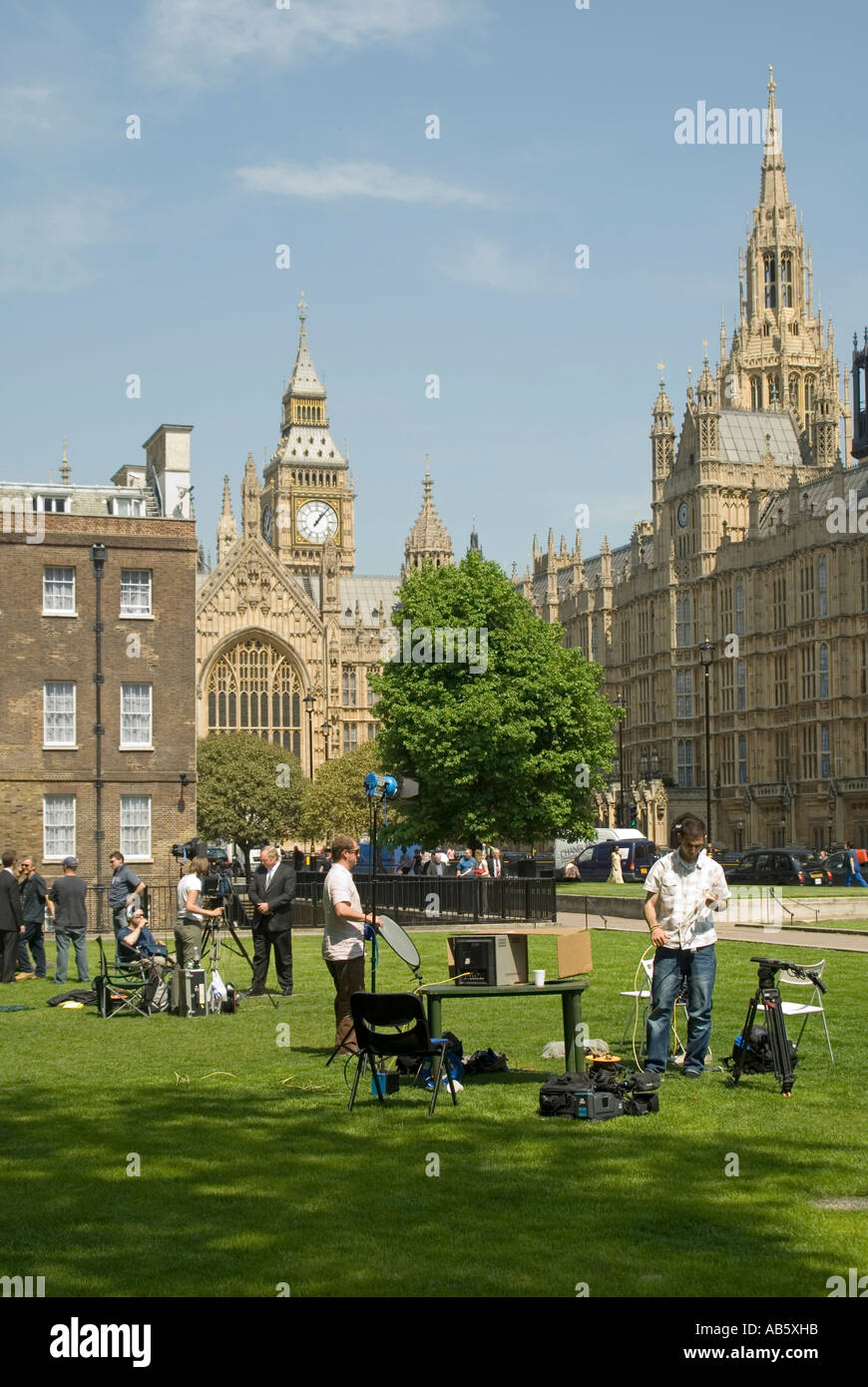 College Green at House of Lords & Houses of Parliament with TV crew & interview reporter journalists at work filming politician Westminster London UK Stock Photo