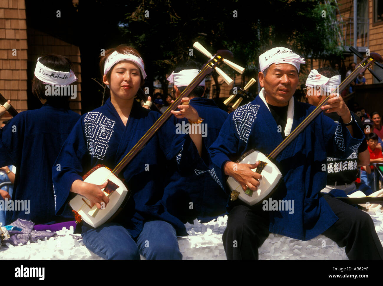 Japanese men, playing string instrument, three-stringed banjo, Cherry Blossom Festival, Post Street, Japantown, San Francisco, California Stock Photo