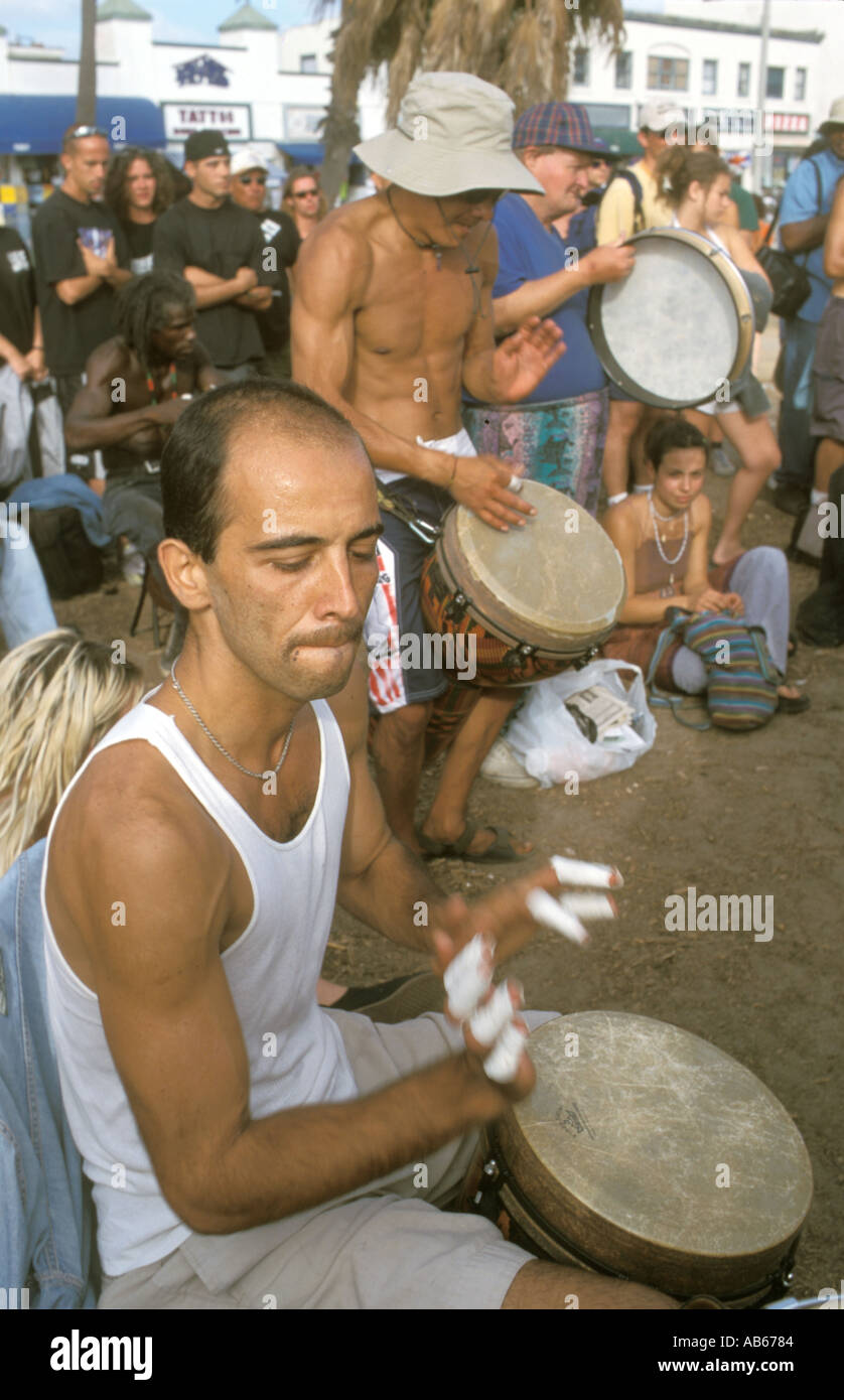 Drummers at drum circle gathering Venice Beach Los Angeles California