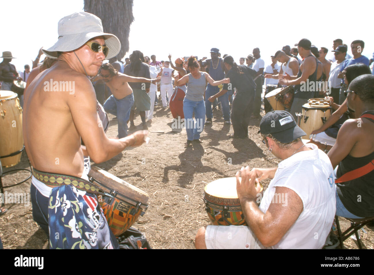 Drummers watcher dancers at drum circle gathering Venice Beach Los
