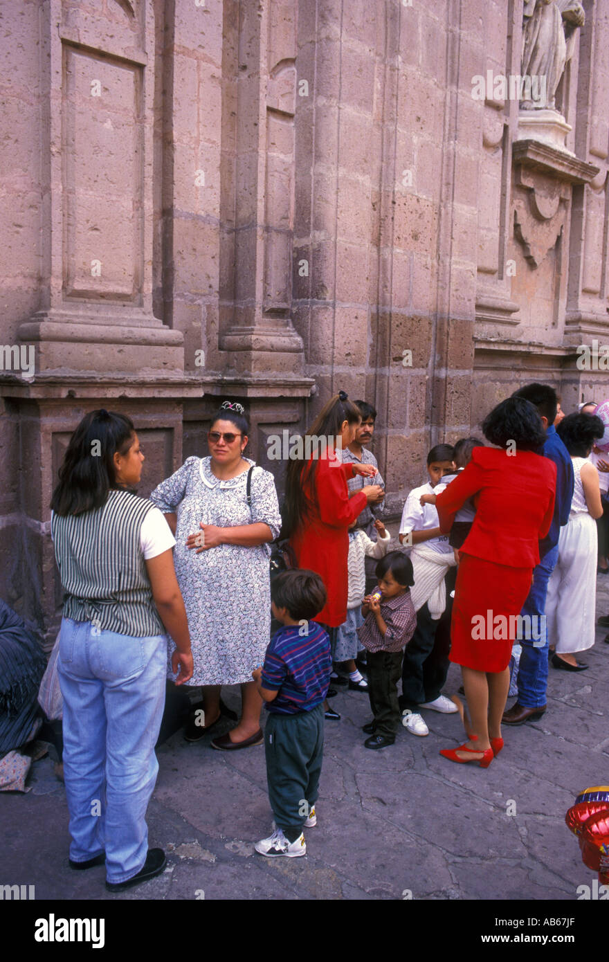 Mexicans, Mexican people, women, girls, waiting in line for baptism, Cathedral, Morelia, Michoacan State, Mexico Stock Photo