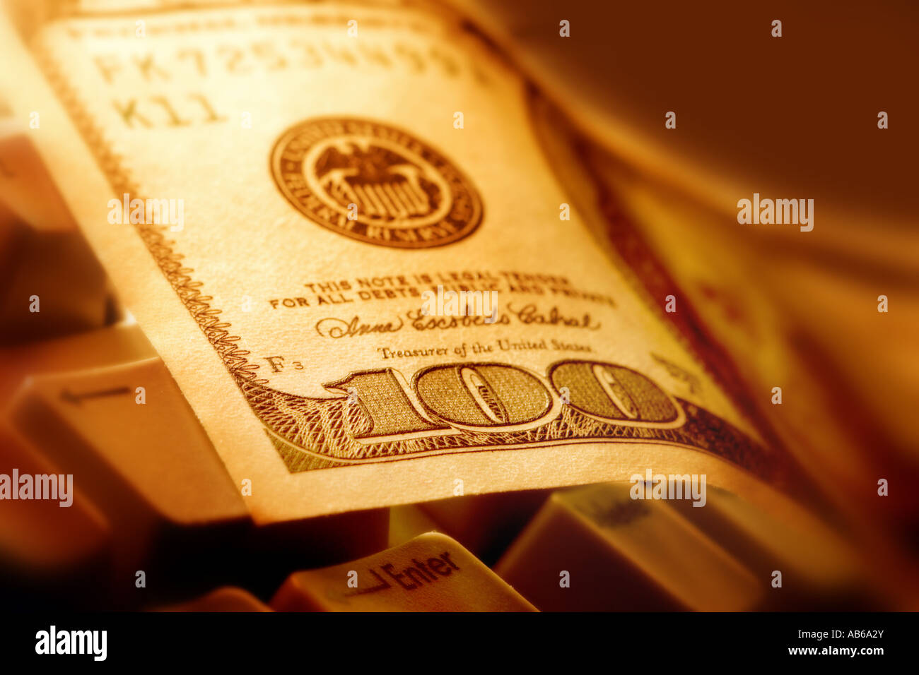 100 dollar note on keyboard Stock Photo - Alamy