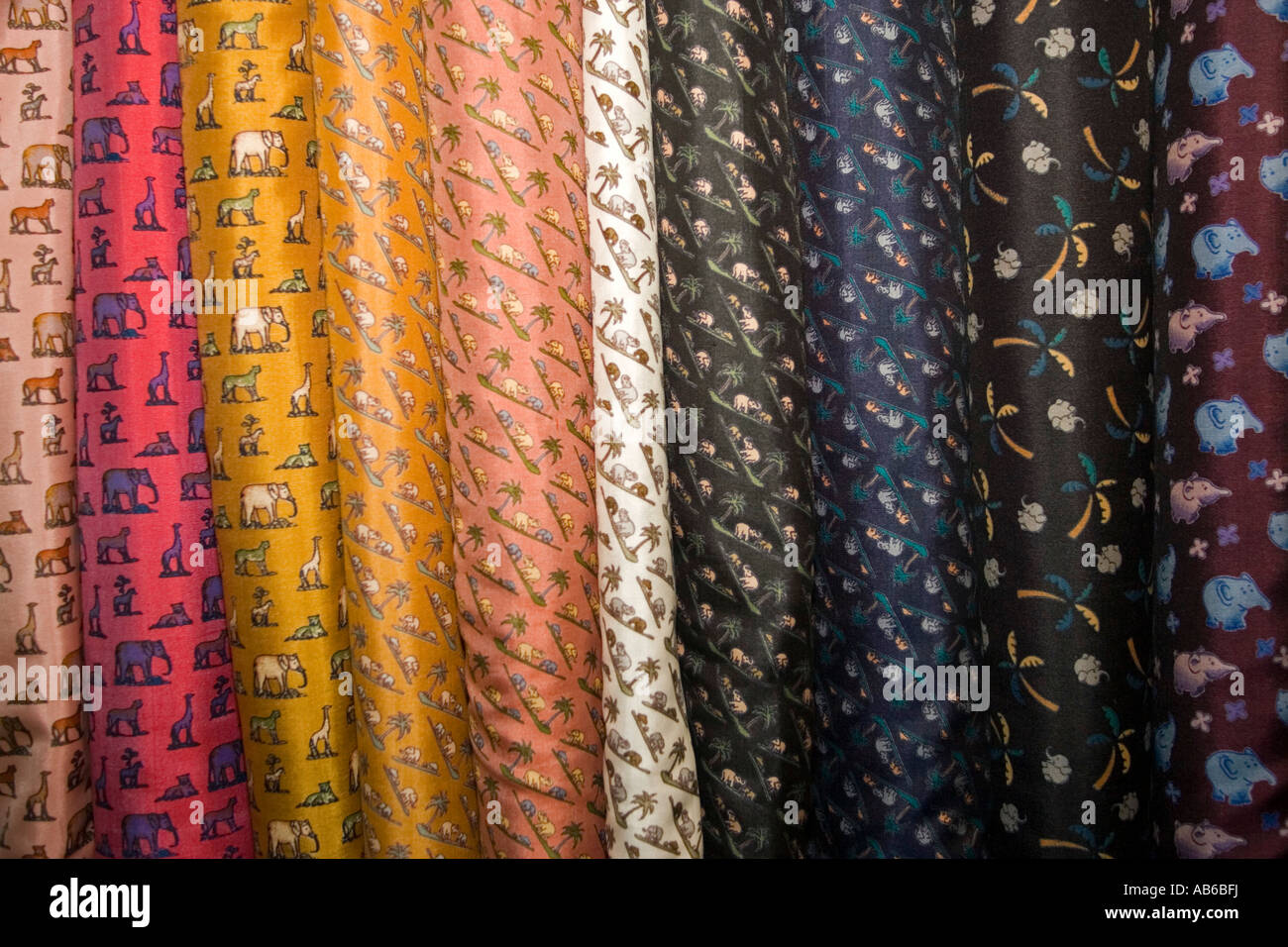 Bolts of design colored silk at factory showroom Chiang Mai Thailand Stock Photo