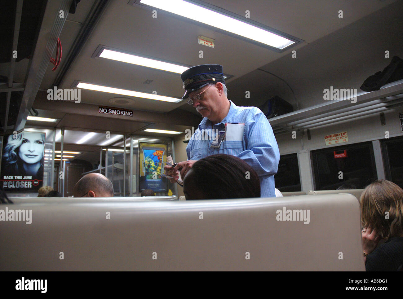 Ticket collector collecting tickets on the New Haven railroad train