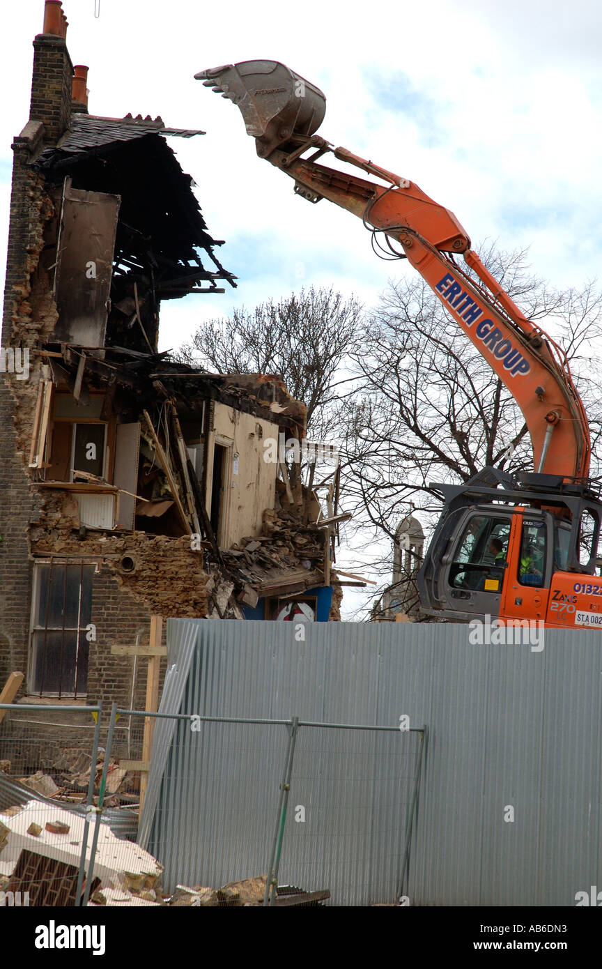 Lambeth Council digger demolishing the last remaining house Negusa Negast-3  from St Agnes Place Kennington a street in South Lo Stock Photo