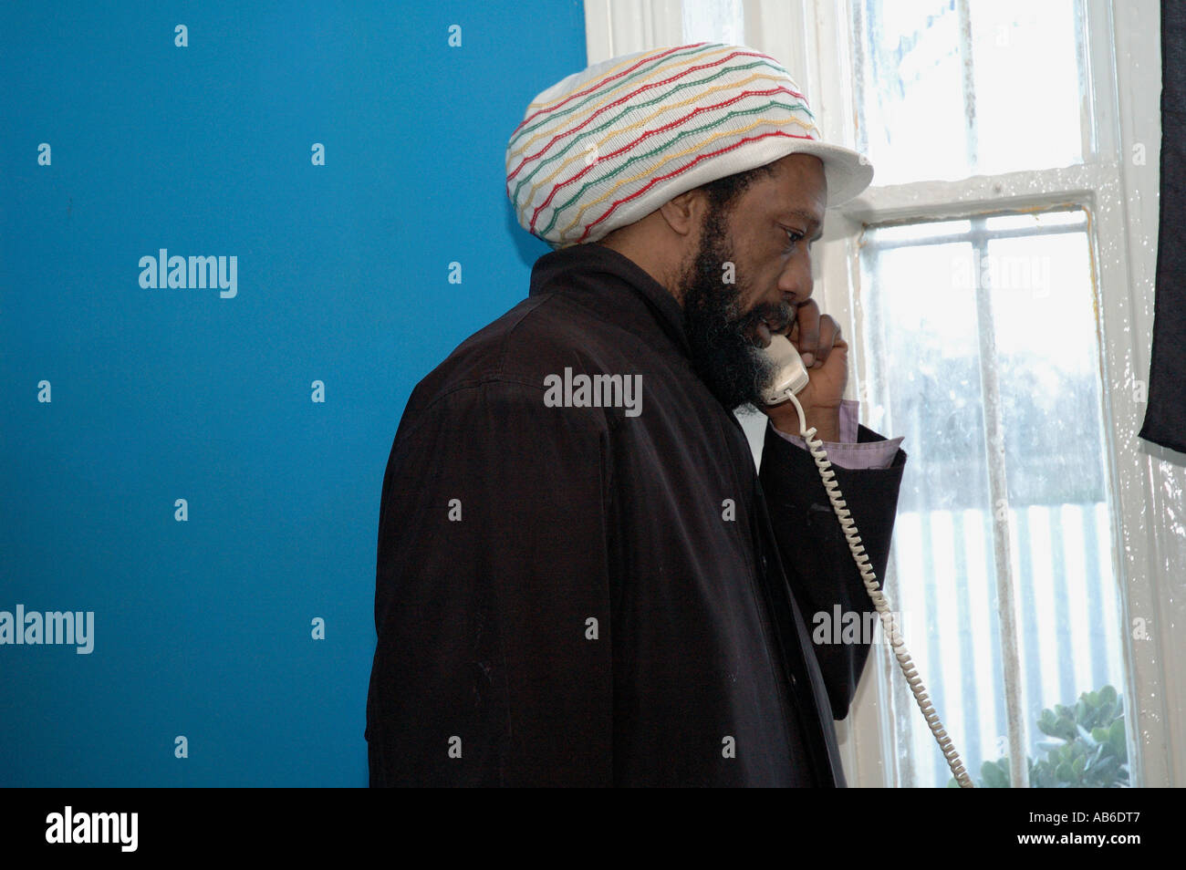 Rastafarian Ras Napthali in office making important phone call Stock Photo