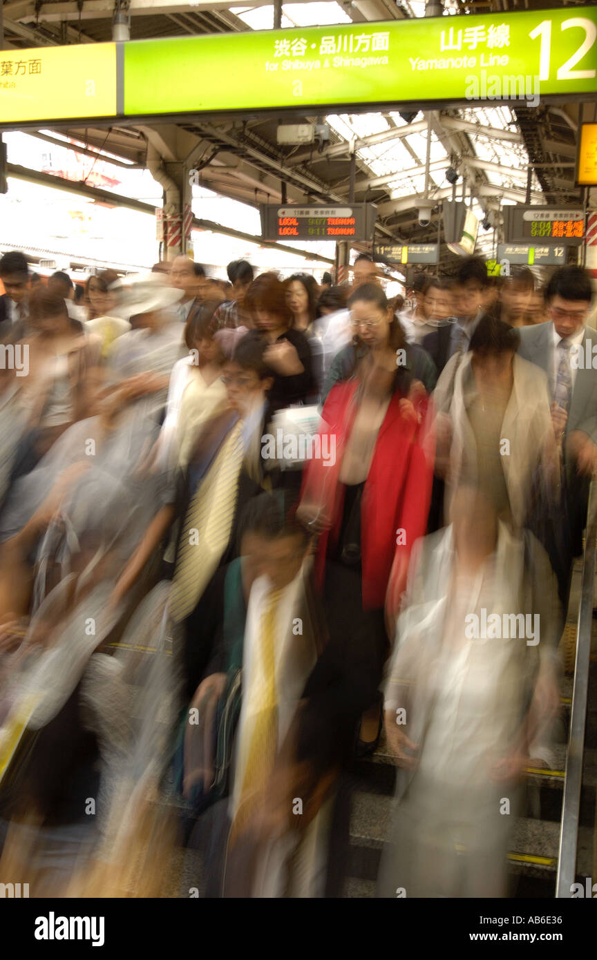 Blur motion image of many commuters during rush hour at Shinjuku Station Tokyo Stock Photo