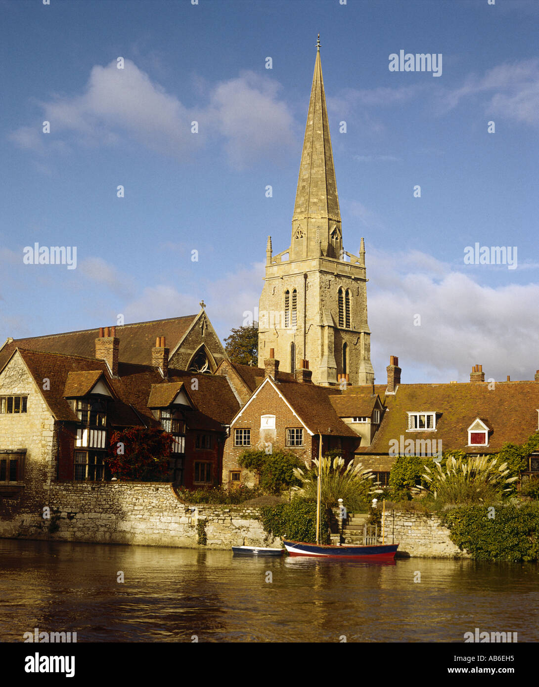 St Helens Church and a couple of cottages beside the River Thames at Abingdon Stock Photo